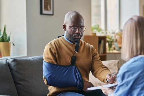 Motorcycle Accident Victim With Arm Injury Consulting Attorney