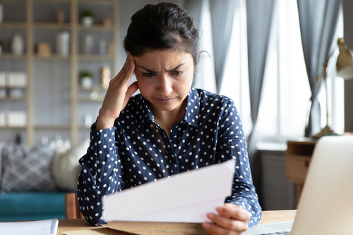 Woman Stressed Reading Insurance Denial Letter The Villages FL