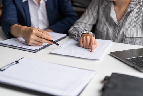 Chandler Attorney Reviewing Unfair Trust Terms With Client