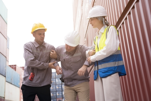 Biloxi Workers Helping Injured Coworker After Job Accident