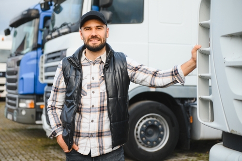 Professional Semi-Truck Driver Standing by Truck Lancaster