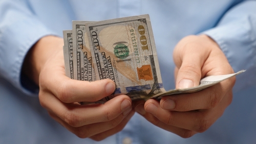 Man Counting Cash Wage Garnishment Worcester MA