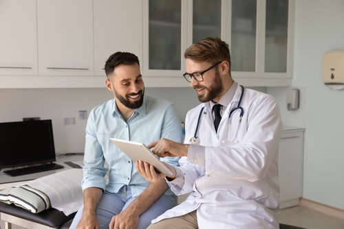 Las Vegas Doctor Consulting Patient About Workers Comp Health Insurance
