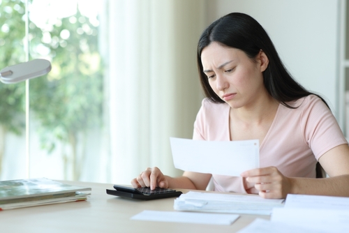 Houston Homeowner Reviewing Lowball Insurance Claim Offer