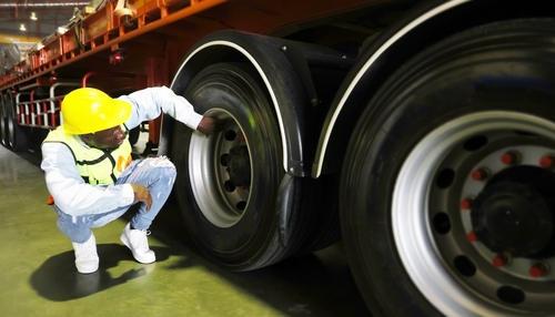 Trenton Commercial Truck Brake System Inspection Worker