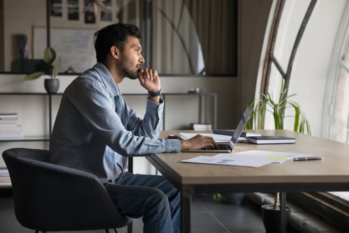 Man Reviewing Nebraska Wrongful Death Insurance Claim Documents Man Reviewing Nebraska Wrongful Death Insurance Claim Documents