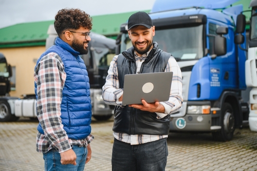 Houston Truck Drivers Reviewing Black Box Data on Laptop