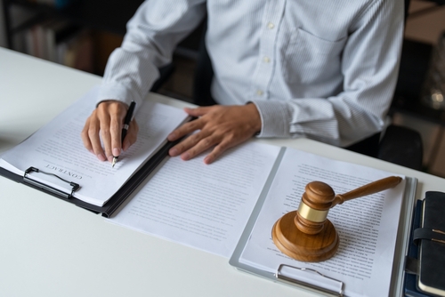 Arizona Defense Lawyer Reviewing Kidnapping Felony Case Documents
