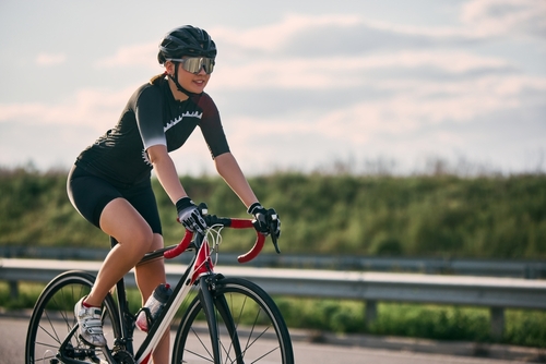 Female Cyclist Riding Road Bike in Ocala FL