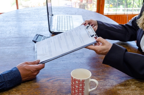 Denver Car Accident Lawyer Reviewing Legal Documents With Client Denver Car Accident Lawyer Reviewing Legal Documents With Client