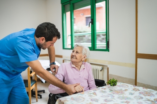 Philadelphia Nursing Home Caregiver Assisting Elderly Resident Philadelphia Nursing Home Caregiver Assisting Elderly Resident