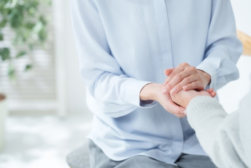 Two people holding hands