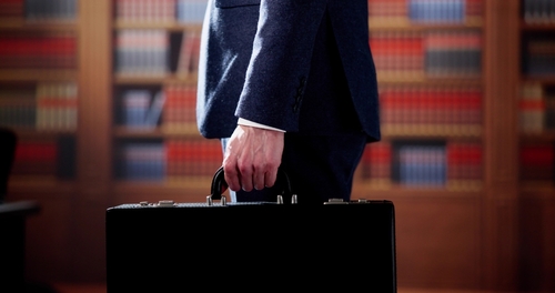 Workers Compensation Lawyer in Dayton Ohio Man walking with a briefcase
