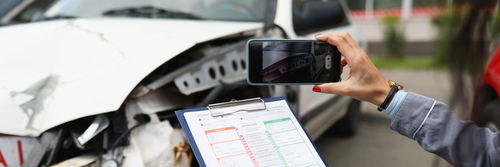 Orlando Insurance Agent Photographing Crashed Car Damage
