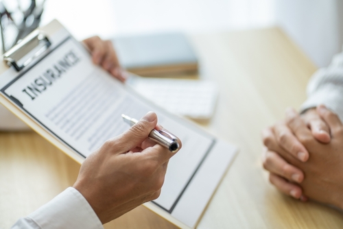 Insurance Adjuster Inspecting Houston Home After Claim Denial Insurance Adjuster Inspecting Houston Home After Claim Denial