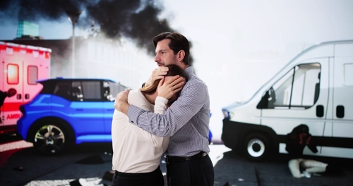 Neck Pain After Philadelphia Commercial Auto Accident Woman touching neck while sitting in damaged car after collision