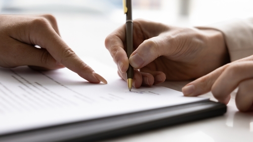 Houston Attorney Reviewing Denied Home Insurance Claim Document Houston Attorney Reviewing Denied Home Insurance Claim Document