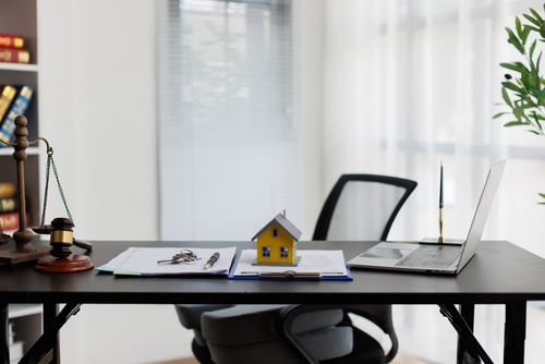 Mesa Arizona Probate Attorney Desk With Gavel and Estate Documents legal desk with gavel, scales of justice, house model, keys, and documents