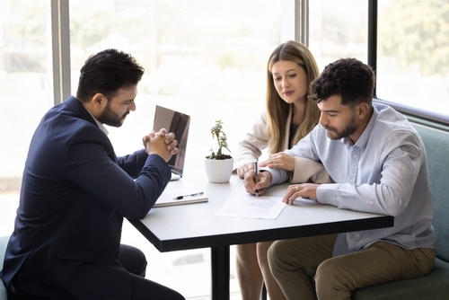 Couple Signing Prenuptial Agreement With Texas Attorney Couple Signing Prenuptial Agreement With Texas Attorney