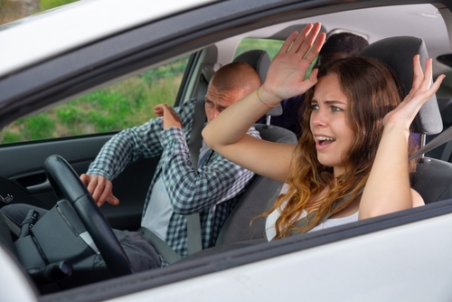 Scared Passenger and Driver During Centennial Car Crash driver and passenger bracing with raised arms screaming inside moving vehicle