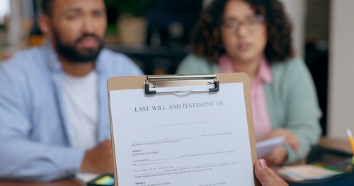Last Will and Testament Document Albuquerque Estate Planning Last Will and Testament document on clipboard held during client meeting