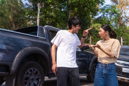 Brooklyn Drivers Disputing No-Fault Insurance After Car Accident two drivers arguing beside vehicles following car accident collision