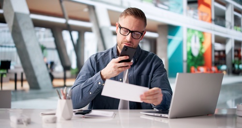 Texas Employee Reviewing Holiday Overtime Paycheck