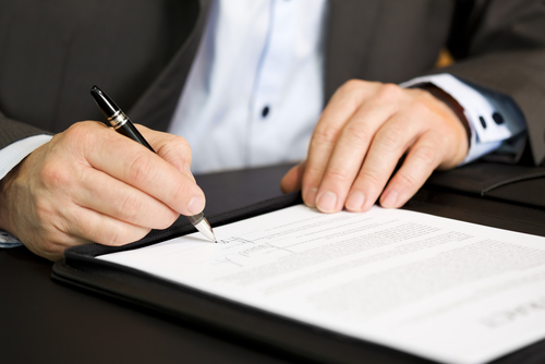 Man writing on a piece of paper